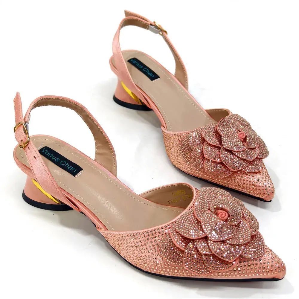 Pink slingback heel white background