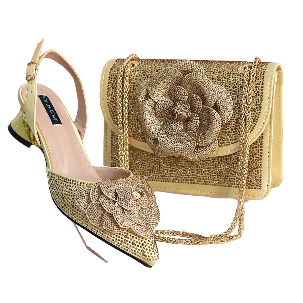 gold high-heeled shoes and matching handbag with floral design on a white background