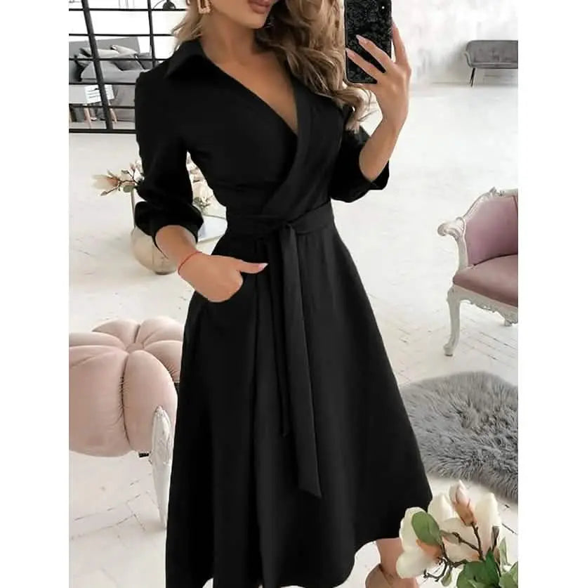 Woman wearing a black dress in an indoor setting